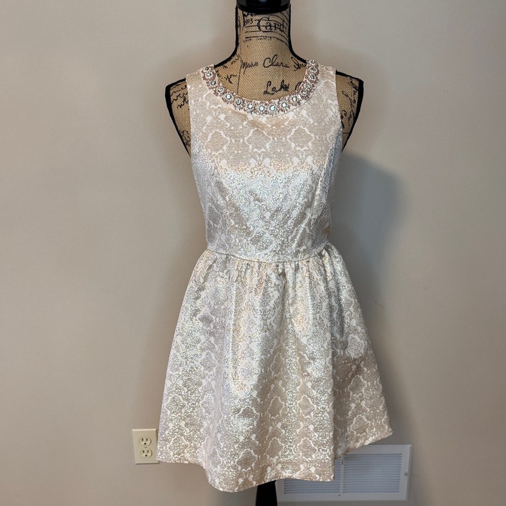 Romeo & Juliet Couture metallic Cream Dress with Embellished Neckline